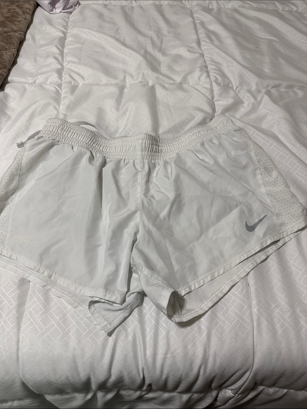 Nike Women's Light White Athletic Running Shorts with Subtle Swoosh